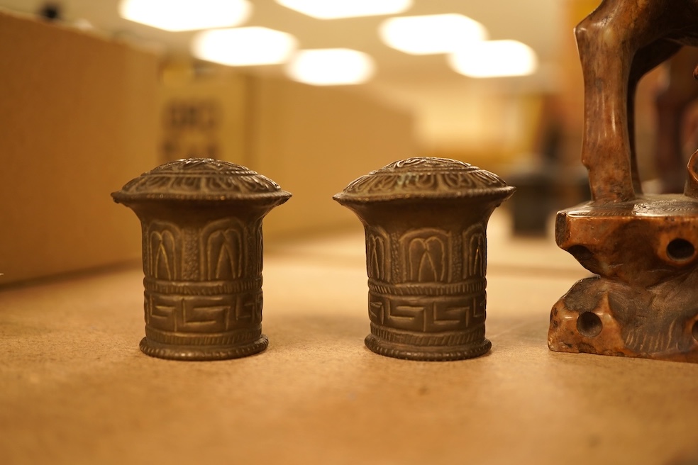 Chinese items comprising a soapstone carving, three jade carvings, one with gilt metal pendant mounts and two brass knops